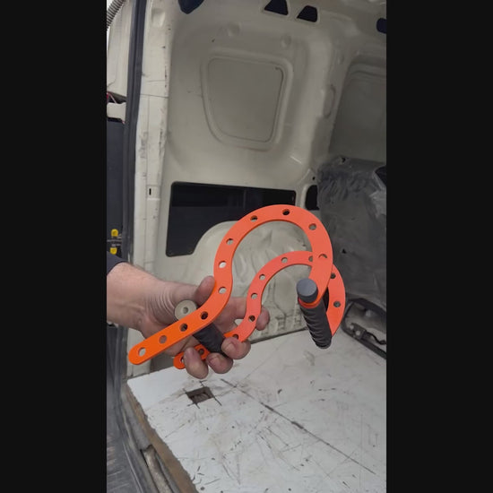 PDR technician using the ceiling hanger bracket for leverage