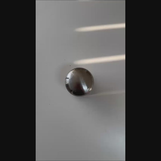 Close-up of the domed knob profile on the DentPDR backing tool