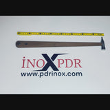 Professional stainless steel PDR hammer resting on a metal panel